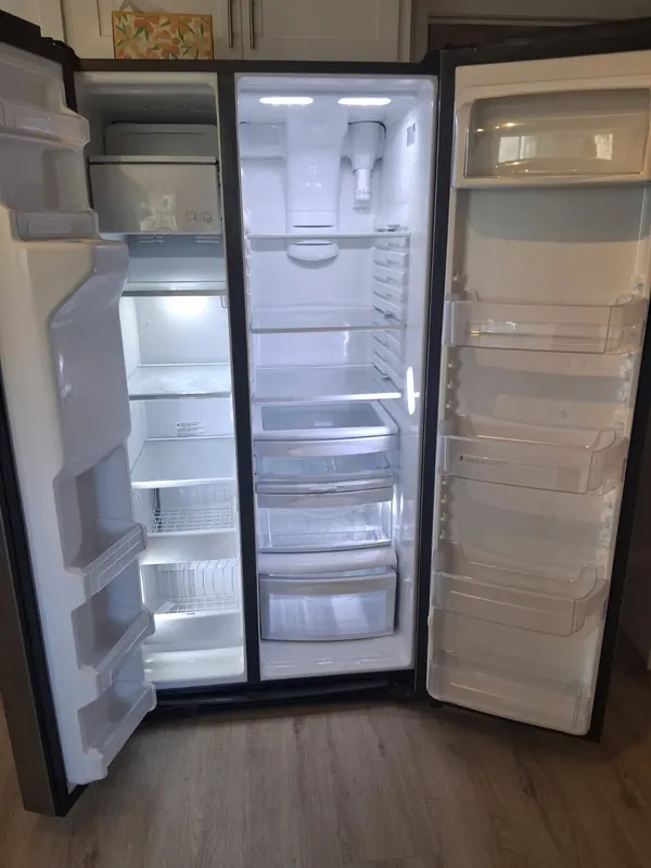 Inside of an empty side-by-side refrigerator after a move-in cleaning in Thousand Oaks