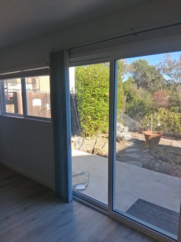 Empty back room with a sliding glass door to the patio after a move-in cleaning in Thousand Oaks